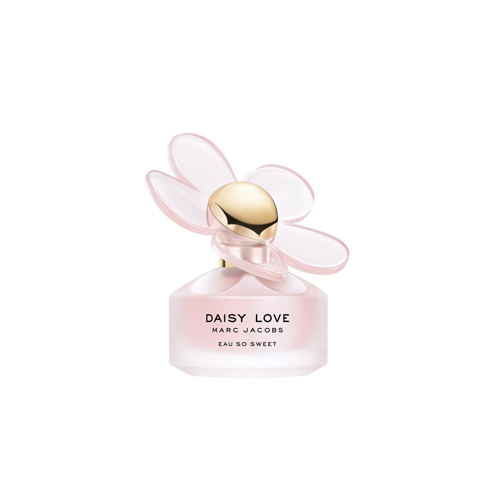 A bottle of MARC JACOBS DAISY LOVE EAU SO SWEET by MARC JACOBS features a frosted pink glass base and a gold cap with translucent pink flower petals, delivering an irresistibly romantic floral fragrance.