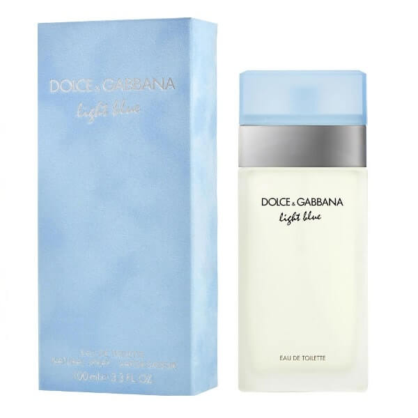 A bottle of DOLCE & GABBANA LIGHT BLUE WOMEN stands beside its light blue rectangular box with silver and white text, both set against a white background—evoking a fresh, vibrant Mediterranean fragrance by DOLCE & GABBANA.