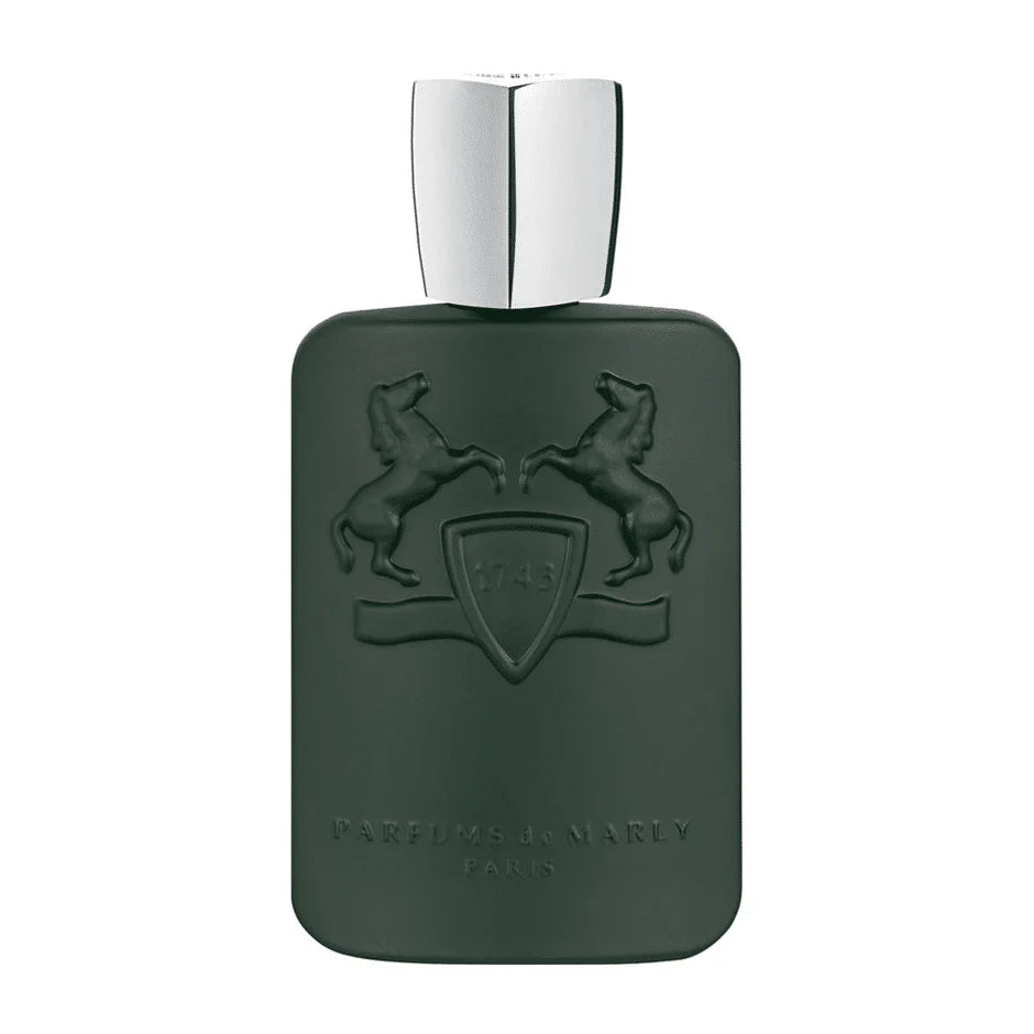 Green perfume bottle with silver cap on a white background