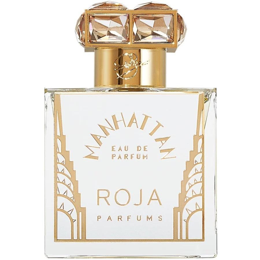 Manhattan Eau de Parfum bottle by Roja Parfums with gold accents on a white background