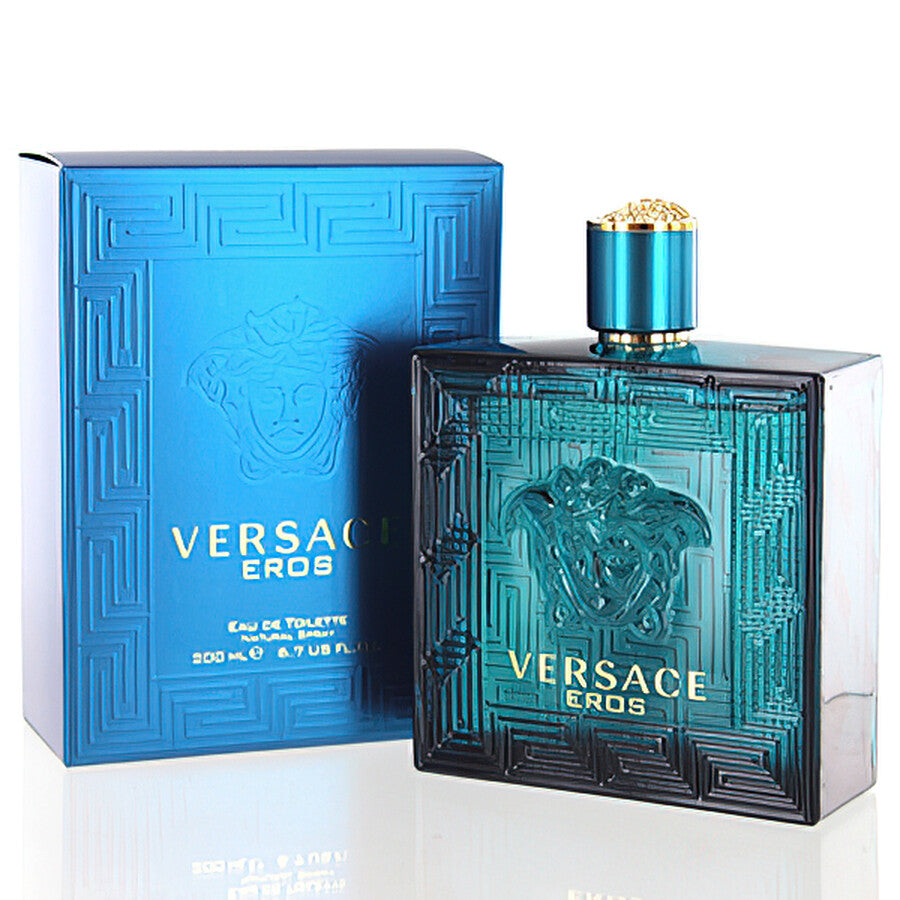 The VERSACE EROS EDT features a turquoise-blue geometric bottle with the Medusa logo, paired with a matching blue box with gold lettering—an iconic men’s fragrance from VERSACE known for its bold style.