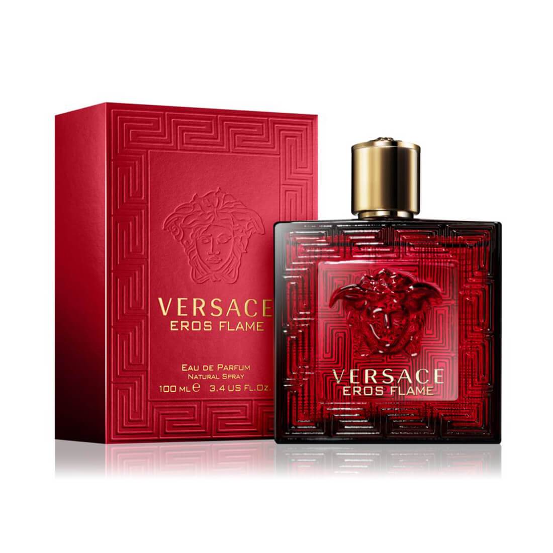 A VERSACE EROS FLAME perfume bottle with a gold cap stands beside its matching red box, both featuring the Medusa logo. This bold men’s eau de parfum by VERSACE comes in a 100 ml (3.4 fl oz) size.